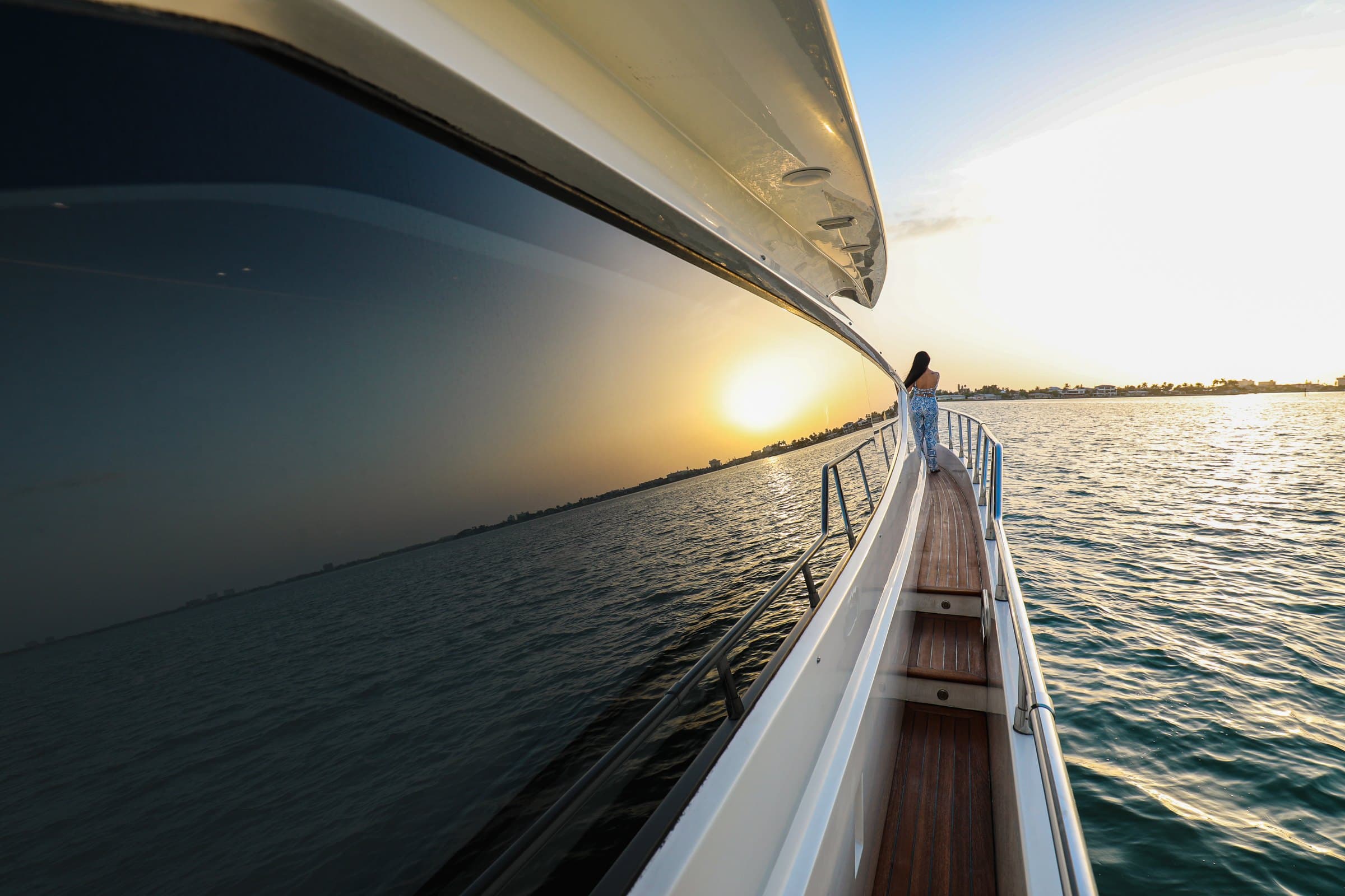 Sunset from the side deck of the 68' Uniesse on a private yacht charter in St. Petersburg, Florida